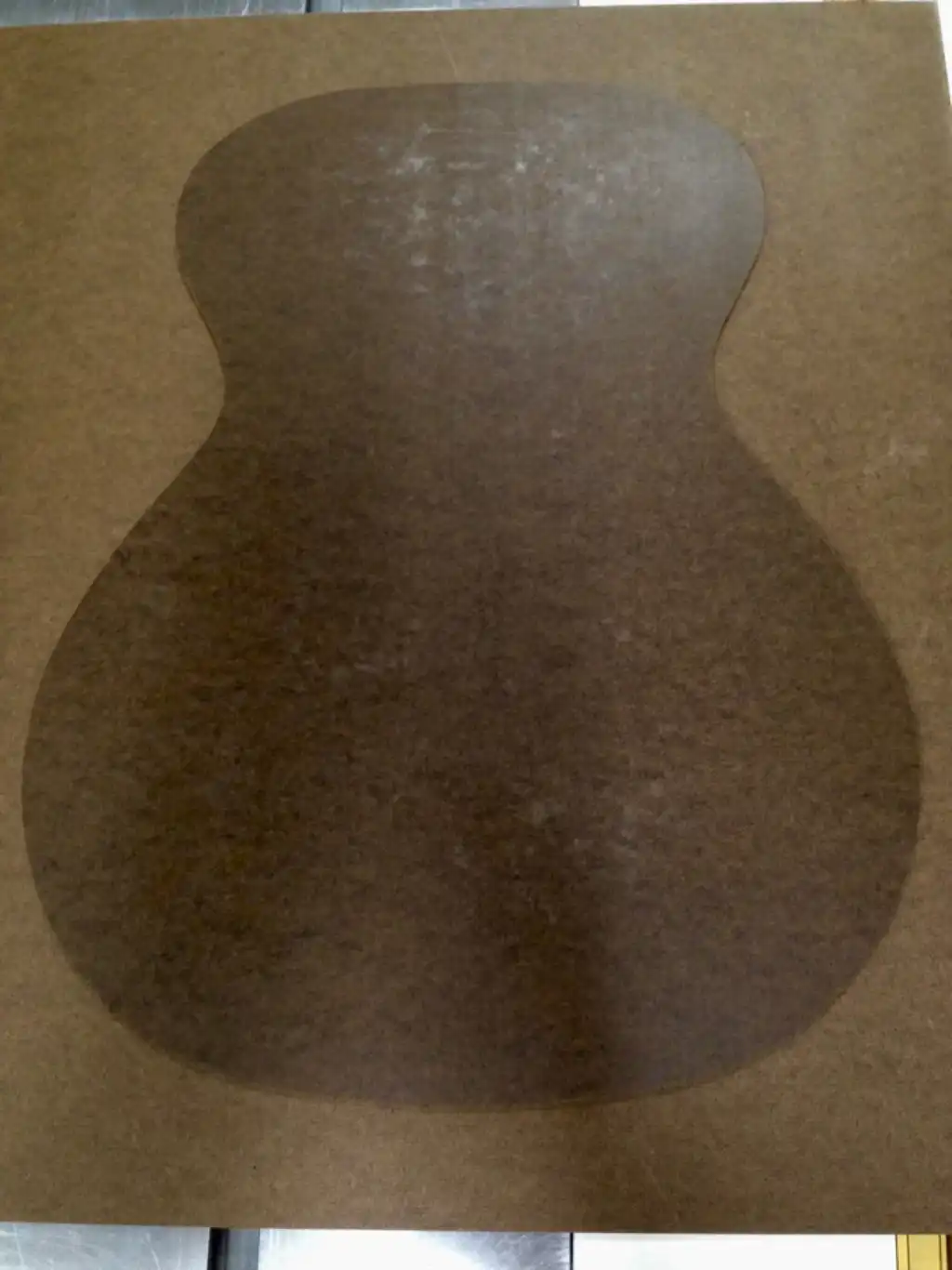 Template taped to hardboard