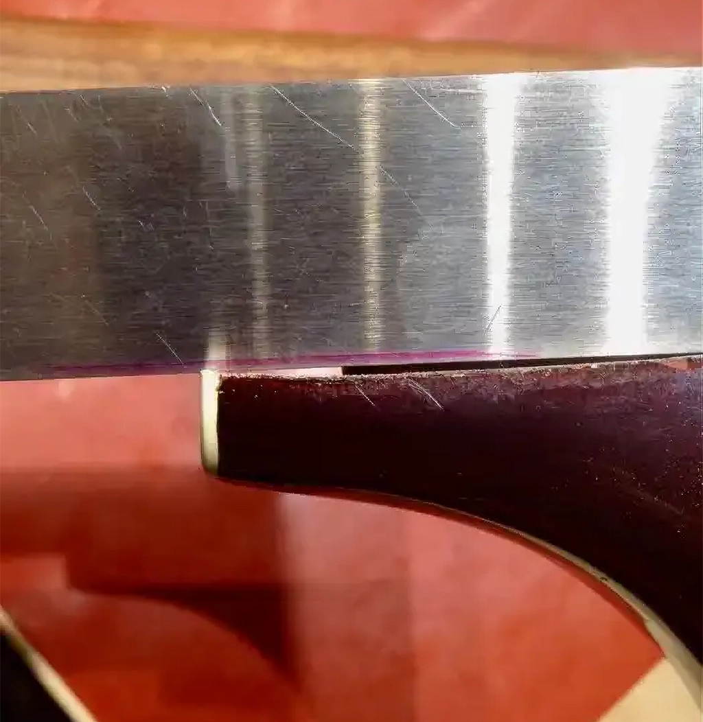 Neck heel wood has curled